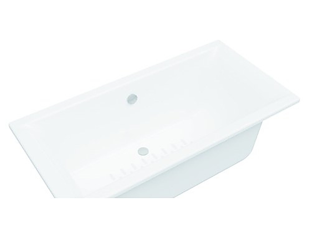 White rectangular inset acrylic bathtub with overflow, installed in a tiled bathroom — studio view on white background